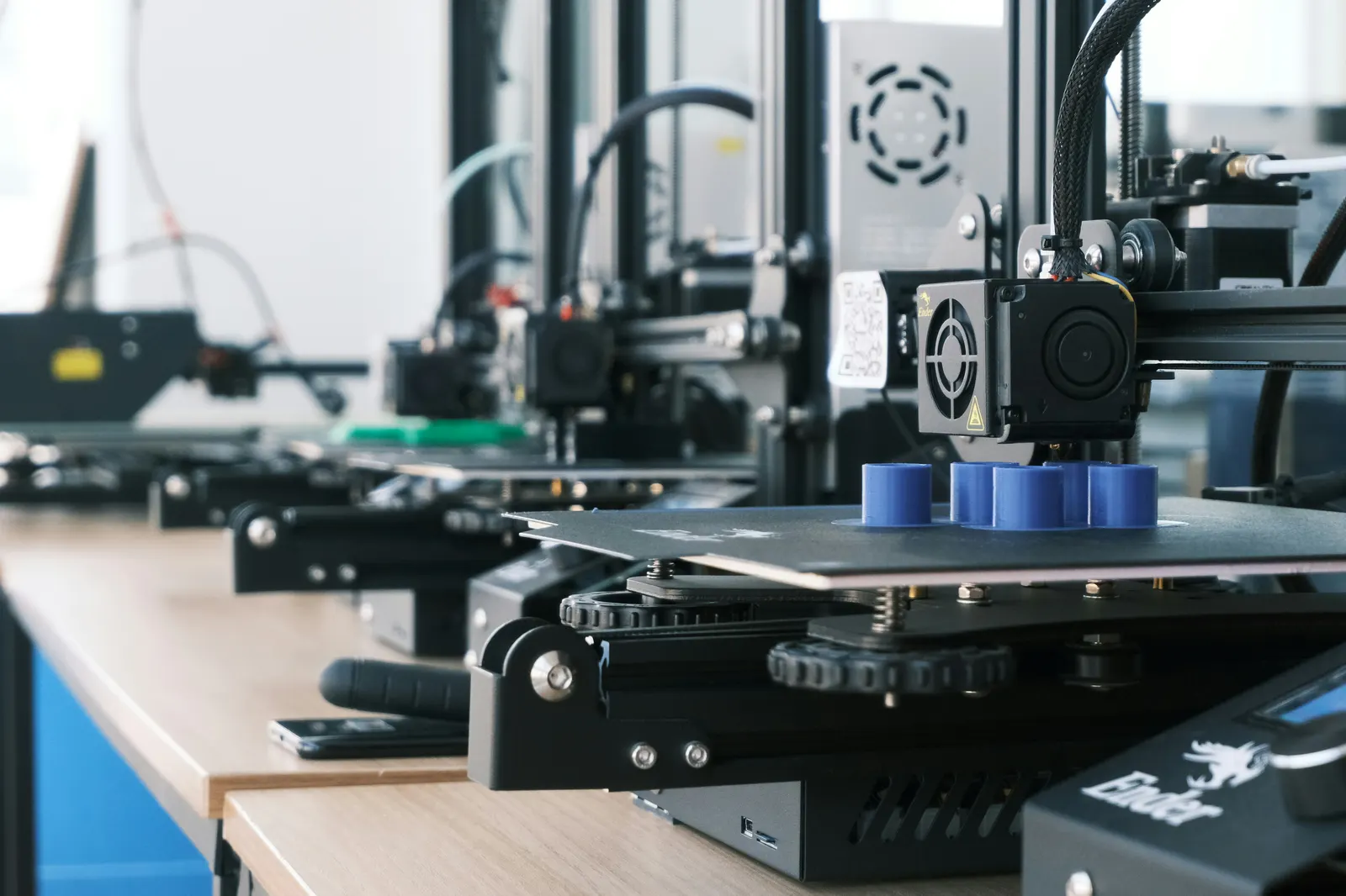 Desktop 3D printers working in a row